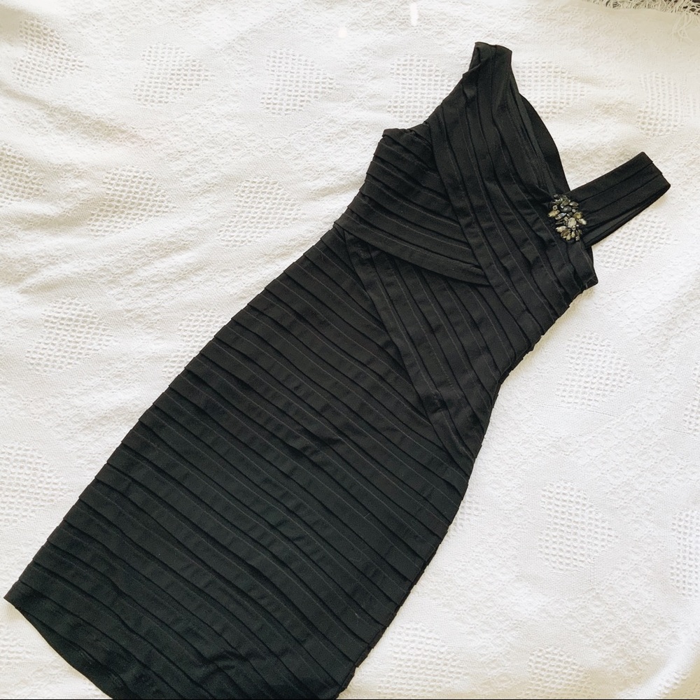 Assymetrical neckline little black dress